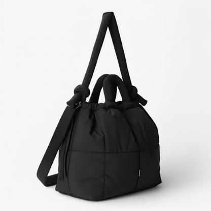 Dark grey quilted puffer bag side view